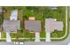An aerial view with a red outline of the property shows the home and surrounding lot with neighboring houses at 2569 Tandori Cir, Orlando, FL 32837