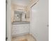 Bathroom featuring white cabinets and granite countertop at 2569 Tandori Cir, Orlando, FL 32837