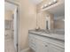 Bathroom featuring white cabinets and granite countertop at 2569 Tandori Cir, Orlando, FL 32837