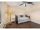 Bedroom with hardwood floors, daybed, ceiling fan and side table at 2569 Tandori Cir, Orlando, FL 32837