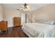 Inviting bedroom with wood floors, ceiling fan, and neutral colors at 2569 Tandori Cir, Orlando, FL 32837