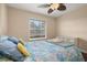Bedroom with hardwood floors, ceiling fan, blinds and a night stand at 2569 Tandori Cir, Orlando, FL 32837