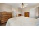 Bright bedroom featuring wood floors, ceiling fan, and plenty of storage at 2569 Tandori Cir, Orlando, FL 32837