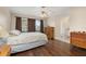 Bedroom featuring wood floors, natural light, and neutral walls at 2569 Tandori Cir, Orlando, FL 32837