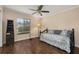 Bright bedroom with hardwood floors, daybed and a ceiling fan at 2569 Tandori Cir, Orlando, FL 32837