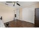 Bedroom features hardwood floors, closet, entry door, and ceiling fan at 2569 Tandori Cir, Orlando, FL 32837