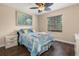 Bedroom featuring hardwood floors, ceiling fan, and a window with blinds at 2569 Tandori Cir, Orlando, FL 32837