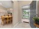 Inviting entryway with tiled floor leading to the open kitchen and dining area at 2569 Tandori Cir, Orlando, FL 32837