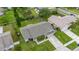 Aerial view of a well-maintained single-Gathering home with a spacious backyard, a long driveway, and a two-car garage at 2569 Tandori Cir, Orlando, FL 32837