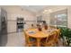 Open kitchen area with stainless steel appliances, light cabinetry, and a connecting dining space at 2569 Tandori Cir, Orlando, FL 32837