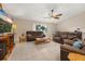 Cozy living room with tile floors and sliding glass door at 2569 Tandori Cir, Orlando, FL 32837