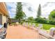 Back patio featuring a dining area with a grill, ideal for outdoor entertaining at 2569 Tandori Cir, Orlando, FL 32837