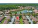 Overhead shot of Regal Oaks community featuring a scenic lake and an array of townhome residences at 2708 Camaro Dr, Kissimmee, FL 34746