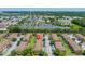 Community aerial view showcasing its location, parking, landscaping, and nearby entertainment attractions at 2708 Camaro Dr, Kissimmee, FL 34746