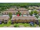 Aerial view of townhome backyards, screened patios, and green space for relaxation and enjoyment at 2708 Camaro Dr, Kissimmee, FL 34746