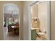 A half bathroom shows a charming space that connects seamlessly with both the living room and dining area at 2708 Camaro Dr, Kissimmee, FL 34746