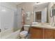 Bathroom features a shower-tub combo, single sink, toilet, and towels at 2708 Camaro Dr, Kissimmee, FL 34746