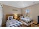 Bedroom features two twin beds, a large window, a side table, and carpet at 2708 Camaro Dr, Kissimmee, FL 34746