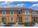 Charming townhome featuring a well-maintained facade, neat landscaping, and ample parking at 2708 Camaro Dr, Kissimmee, FL 34746