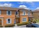 Charming two-story townhome with a well-manicured lawn and neatly trimmed shrubbery at 2708 Camaro Dr, Kissimmee, FL 34746