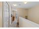 Hallway features neutral color palette, carpet, white trim, and leads to multiple rooms at 2708 Camaro Dr, Kissimmee, FL 34746