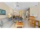 Inviting living room with tile flooring, neutral tones, comfortable seating, and access to dining area at 2708 Camaro Dr, Kissimmee, FL 34746