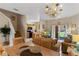 Open-concept living area with adjacent kitchen and staircase to the upper level at 2708 Camaro Dr, Kissimmee, FL 34746