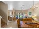 Cozy living room with dining area, open floor plan, and sliding glass doors to the backyard at 2708 Camaro Dr, Kissimmee, FL 34746
