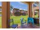 Outdoor patio with seating and view of lawn and other screened patios in the community at 2708 Camaro Dr, Kissimmee, FL 34746