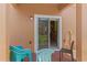 Outdoor patio with seating and view of the grass area and screened patios of the community at 2708 Camaro Dr, Kissimmee, FL 34746