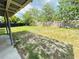 Expansive backyard featuring a mix of lush grass and natural terrain, perfect for outdoor activities and gardening at 329 N Hart Blvd, Orlando, FL 32835