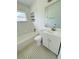 Clean, bright bathroom with a shower-tub combo, modern vanity, and tiled flooring at 329 N Hart Blvd, Orlando, FL 32835