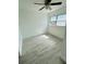 Cozy bedroom with neutral walls, tiled floors, ceiling fan and a bright window at 329 N Hart Blvd, Orlando, FL 32835