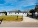 Charming home with a well-maintained front yard, featuring a driveway and tasteful landscaping at 329 N Hart Blvd, Orlando, FL 32835