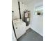 Practical laundry area with a washing machine and water heater, neatly arranged in a well-maintained space at 329 N Hart Blvd, Orlando, FL 32835