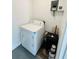 Practical laundry area with a washing machine and essential utilities for convenience at 329 N Hart Blvd, Orlando, FL 32835