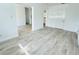 Spacious living room with wood-look flooring, freshly painted walls, and modern design at 329 N Hart Blvd, Orlando, FL 32835