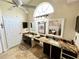 Bathroom with double sinks, granite countertops, decorative mirrors, lighting, and tiled floors at 3407 Santa Monica Dr, Orlando, FL 32822