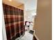 This bathroom has a shower/tub combo, a toilet, and a vanity sink with mirror and lighting at 3407 Santa Monica Dr, Orlando, FL 32822