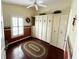 This bedroom has custom cabinets, a ceiling fan, and a window with custom wood shutters at 3407 Santa Monica Dr, Orlando, FL 32822