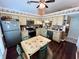 Charming kitchen with updated appliances, wood cabinets, and a cozy breakfast nook area with wood floor at 3407 Santa Monica Dr, Orlando, FL 32822