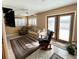 Cozy living area with double doors leading to the outside and a comfortable seating arrangement at 3407 Santa Monica Dr, Orlando, FL 32822