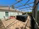 Large screened patio with a hot tub and outdoor furniture at 3407 Santa Monica Dr, Orlando, FL 32822