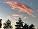 Sunset view with pale orange wispy clouds against a blue sky at 3407 Santa Monica Dr, Orlando, FL 32822