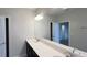 Bathroom with double vanity, modern lighting, and neutral color palette provides a clean and bright atmosphere at 4634 Tribute Trl, Kissimmee, FL 34746