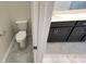 Bathroom view highlights toilet and vanity area, blending convenience and functionality for comfortable living at 4634 Tribute Trl, Kissimmee, FL 34746