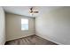 This bedroom offers natural light, neutral tones, and comfortable carpeting, creating a serene and inviting retreat at 4634 Tribute Trl, Kissimmee, FL 34746