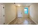 Neutral entryway featuring a front door, window with blinds, and tiled flooring at 4634 Tribute Trl, Kissimmee, FL 34746