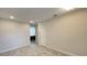 View of a neutral living room with tile floors and recessed lighting at 4634 Tribute Trl, Kissimmee, FL 34746