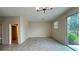Bright and airy living room with tile floors and sliding glass doors leading to the outdoors at 4634 Tribute Trl, Kissimmee, FL 34746